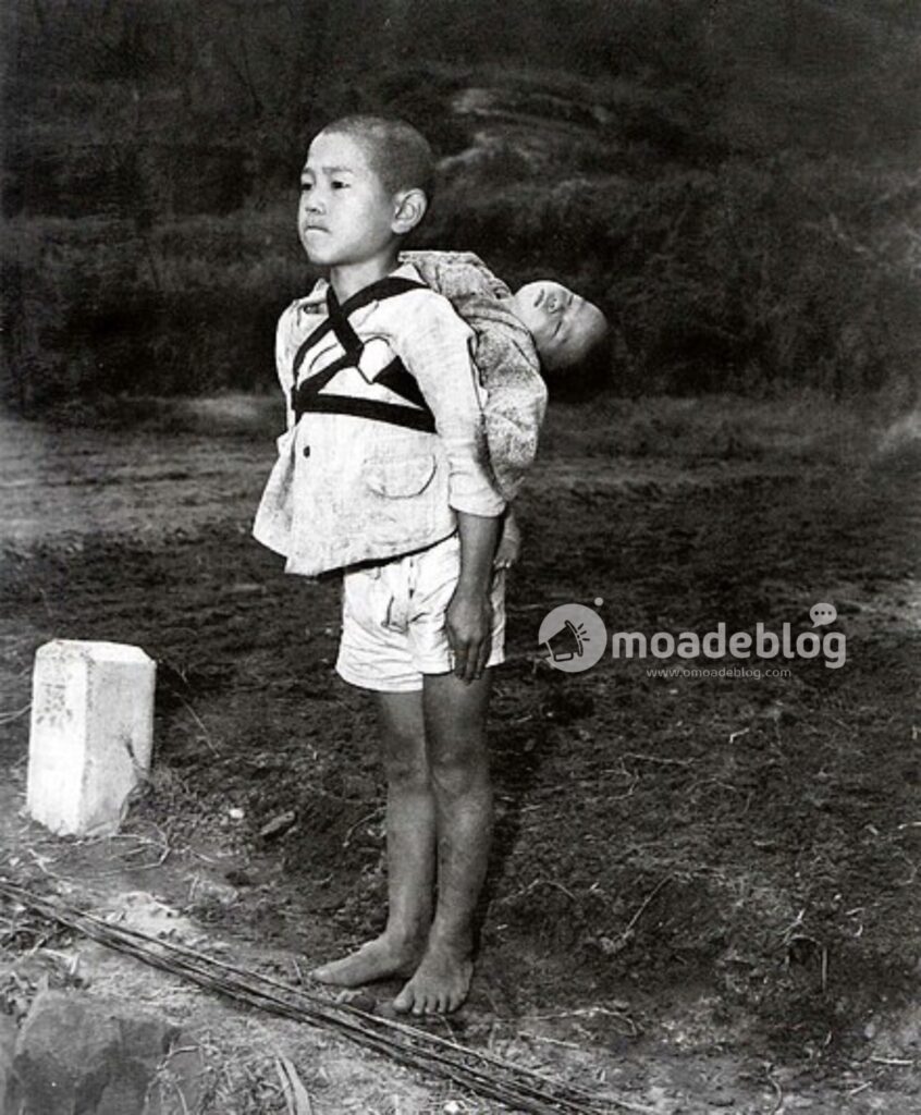 The boy standing by the crematory (1945). This is the original version of the photo, which was flipped horizontally in O'Donnell's reproduction.